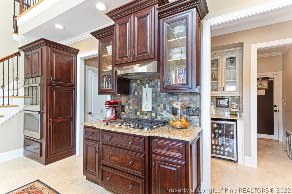 375 East Lake Ridge Road Raeford, NC 28376 - Photo 25 of 50 a kitchen with stainless steel appliances granite countertop a refrigerator and a stove top oven