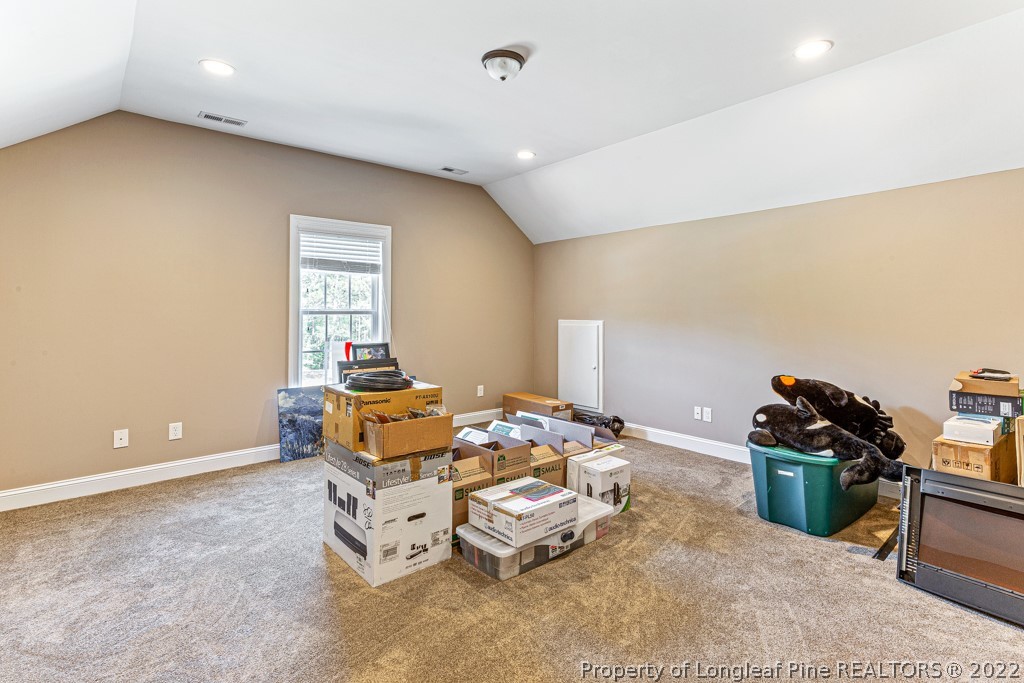 375 East Lake Ridge Road Raeford, NC 28376 - Photo 38 of 50 a living room with furniture and a flat screen tv