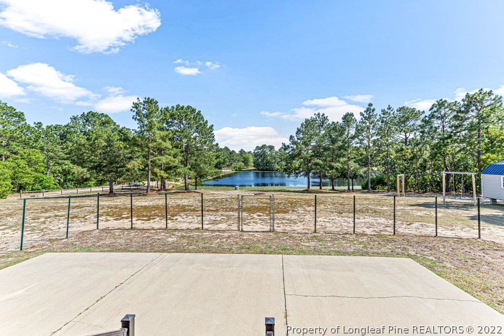 375 East Lake Ridge Road Raeford, NC 28376 - Photo 39 of 50 a view of a yard with wooden fence
