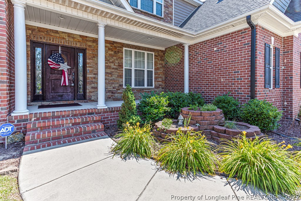 375 East Lake Ridge Road Raeford, NC 28376 - Photo 4 of 50 a view of a house with potted plants