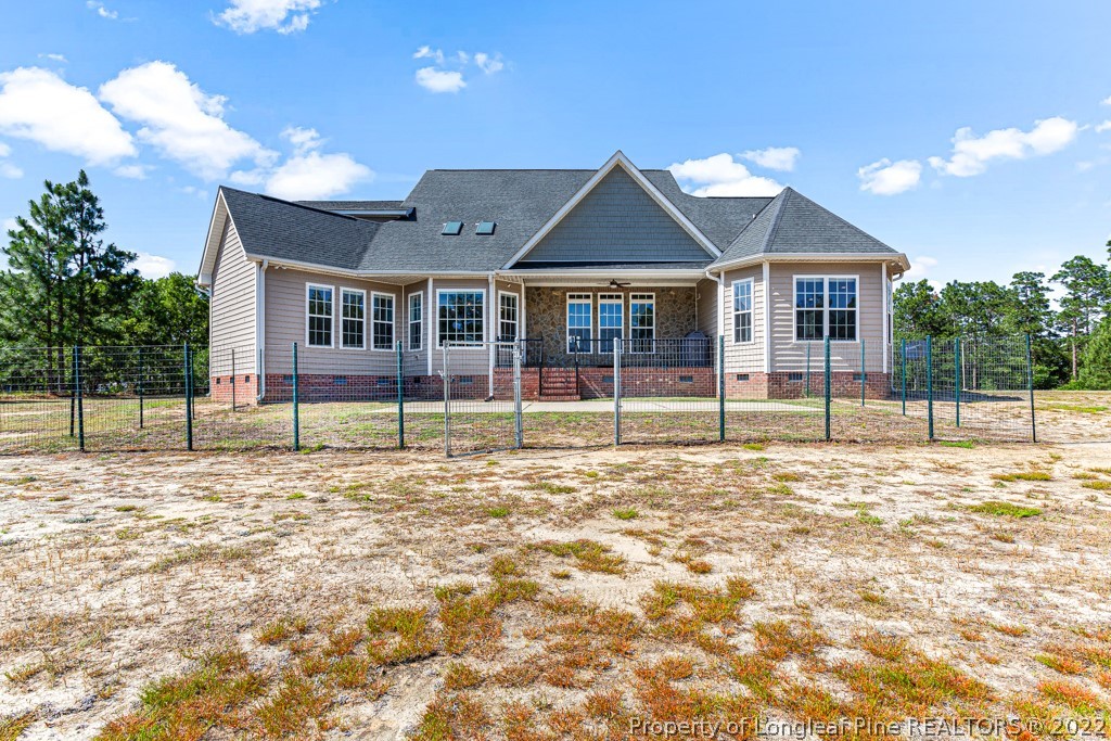 375 East Lake Ridge Road Raeford, NC 28376 - Photo 43 of 50 a house with trees in the background