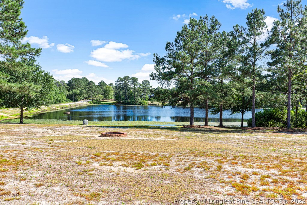 375 East Lake Ridge Road Raeford, NC 28376 - Photo 44 of 50 a swimming pool that is in the water next to a building