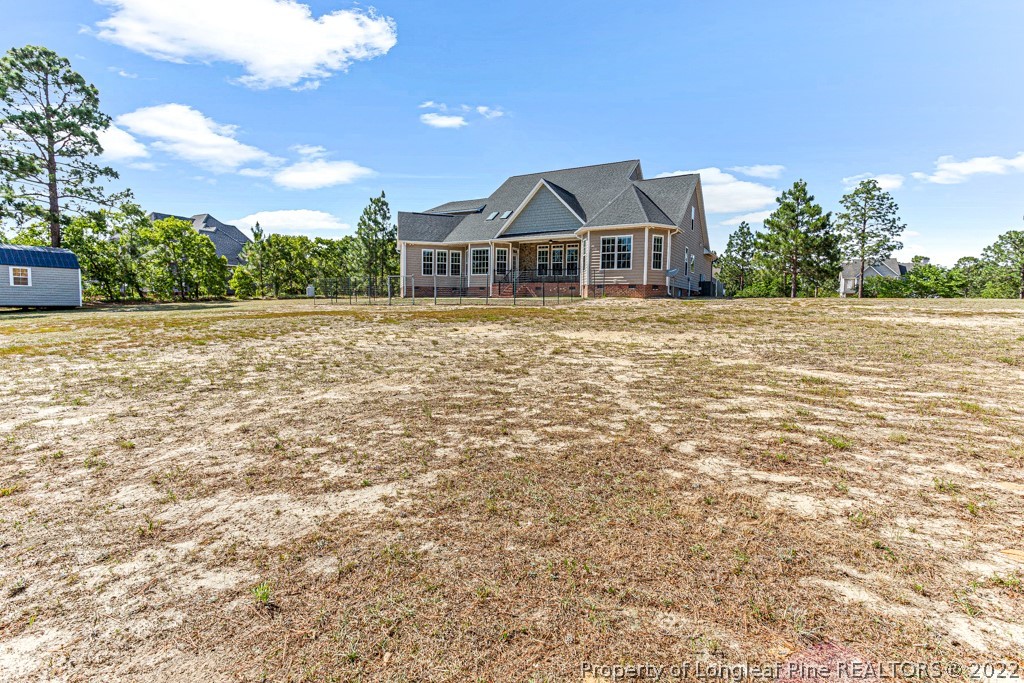 375 East Lake Ridge Road Raeford, NC 28376 - Photo 45 of 50 a house with trees in the background