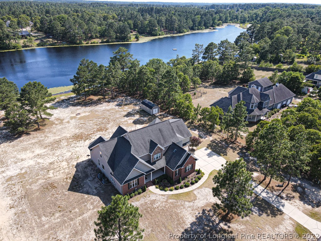 375 East Lake Ridge Road Raeford, NC 28376 - Photo 48 of 50 an aerial view of a house with outdoor space and lake view