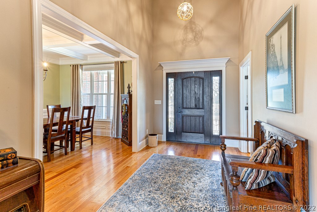 375 East Lake Ridge Road Raeford, NC 28376 - Photo 6 of 50 a view of a hallway with wooden floor and dining room