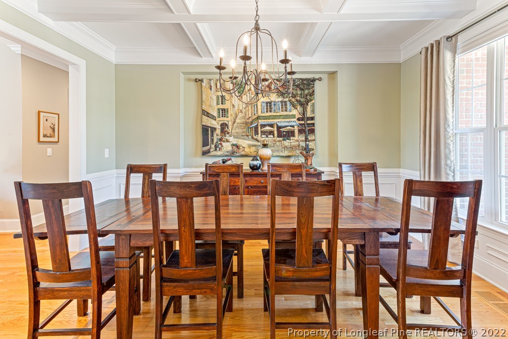 375 East Lake Ridge Road Raeford, NC 28376 - Photo 9 of 50 a view of a dining room with furniture and chandelier