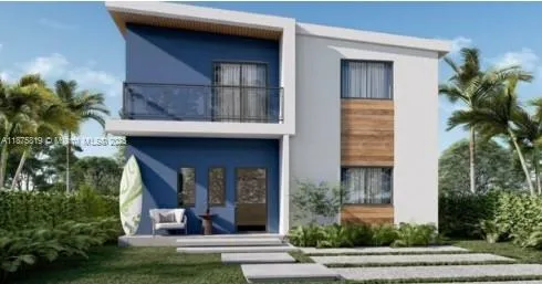 a view of a house with a patio and a yard