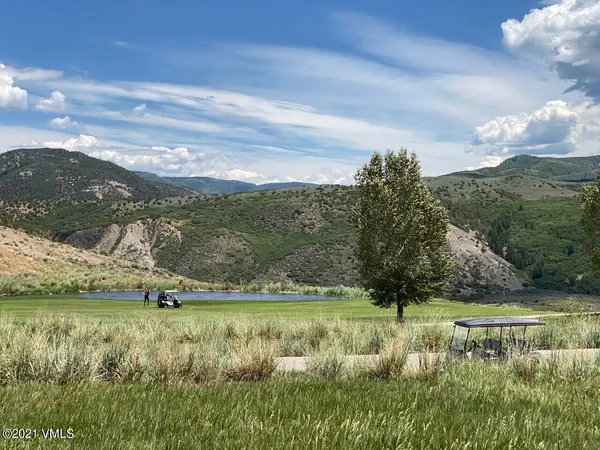 a view of a lake with a mountain in the background