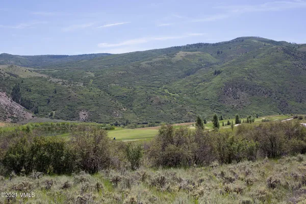 a view of a lake with mountains in the background