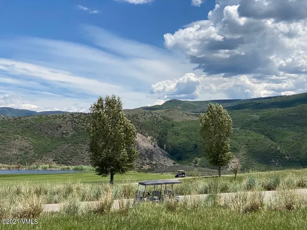 a view of a lake with a yard