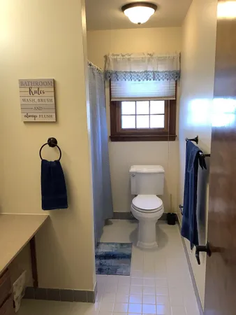 a house that has a tree in front of it