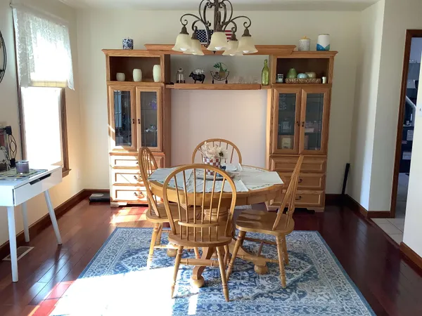 a dining room with furniture and window