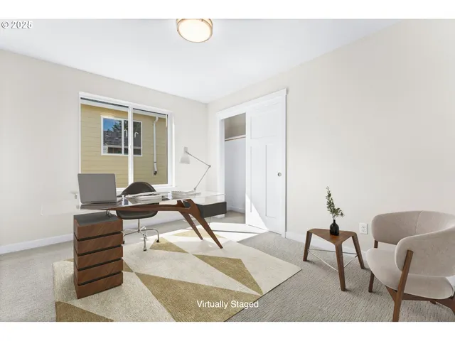 a living room with furniture a wooden floor and next to a window