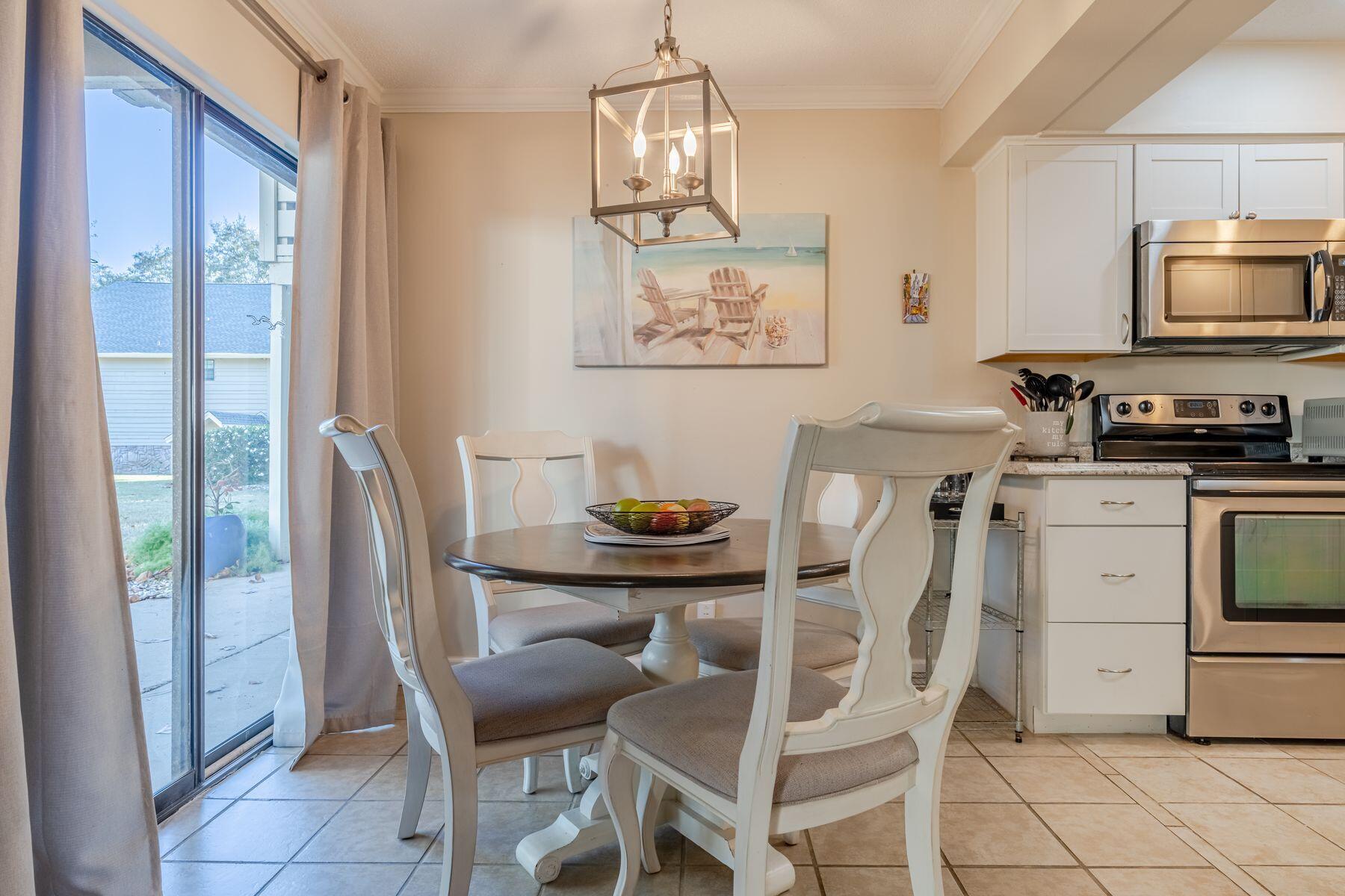 56 Sunset Bay, Unit 17B Miramar Beach, FL 32550 - Photo 1 of 30 a dining room with furniture and window