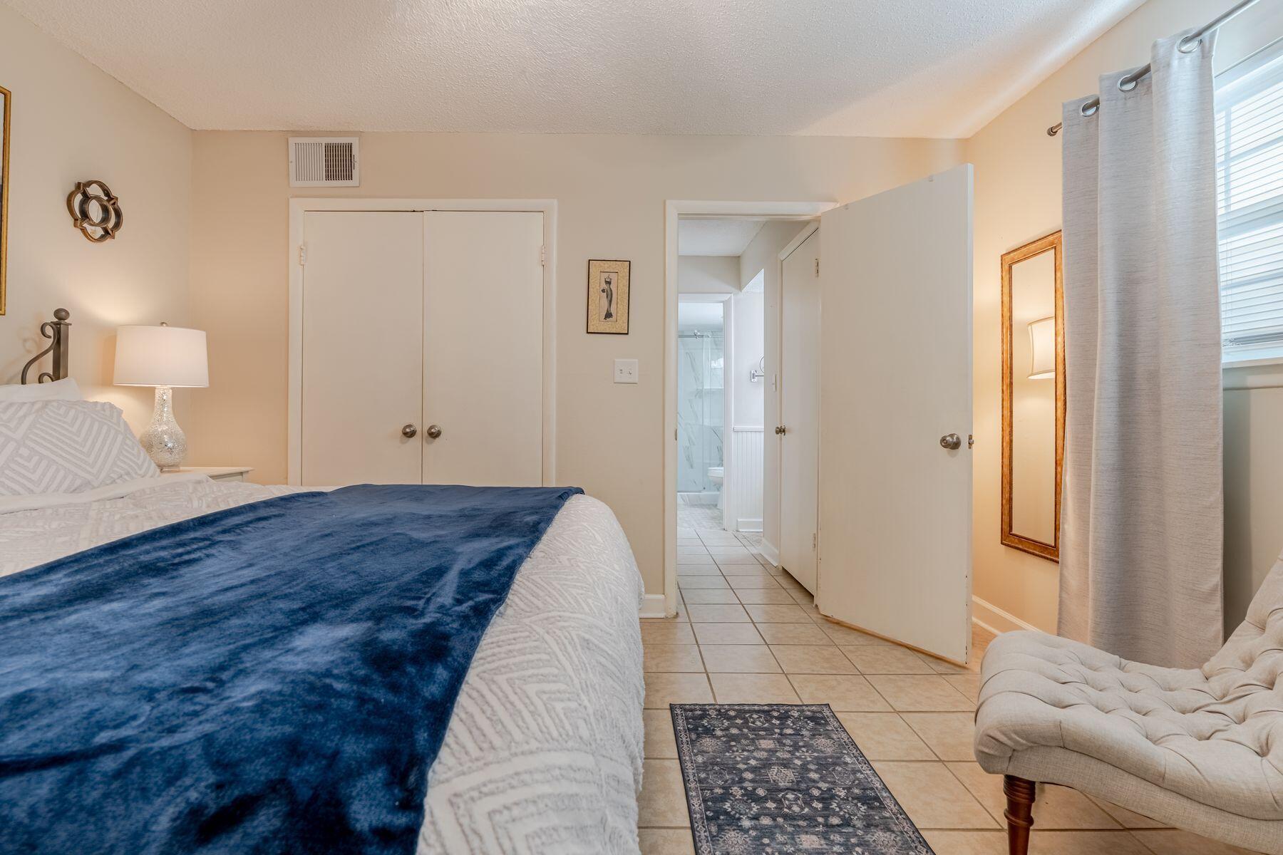 56 Sunset Bay, Unit 17B Miramar Beach, FL 32550 - Photo 15 of 30 a bedroom with a bed and a window