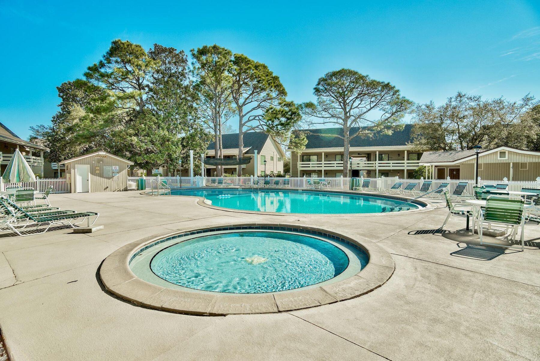 56 Sunset Bay, Unit 17B Miramar Beach, FL 32550 - Photo 22 of 30 a view of a swimming pool with a patio