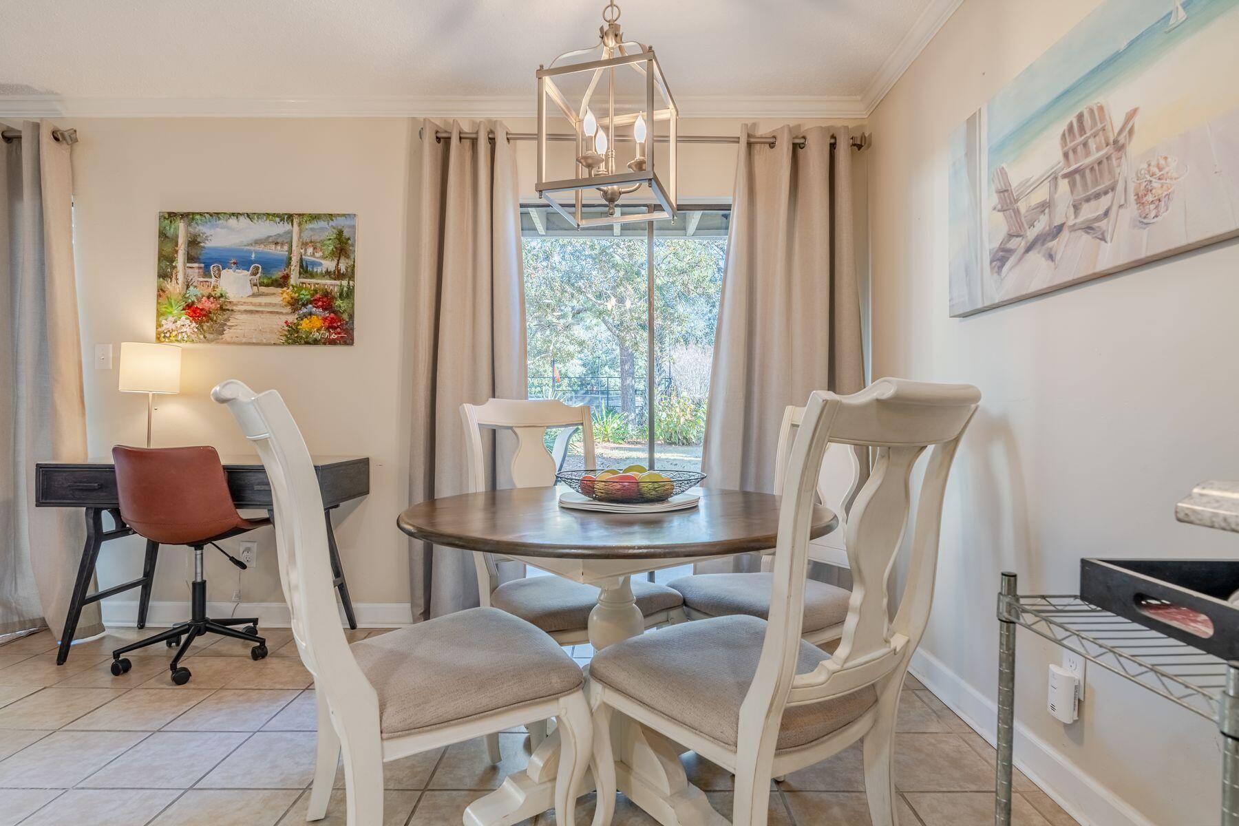 56 Sunset Bay, Unit 17B Miramar Beach, FL 32550 - Photo 4 of 30 a view of a dining room with furniture window and outside view