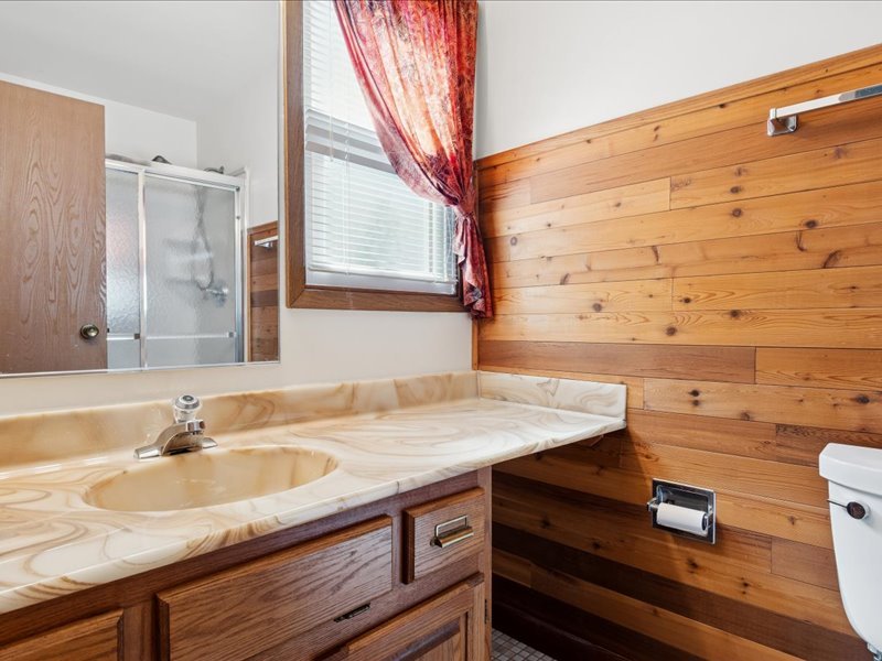 1323 Auburn Avenue Naperville, IL 60565 - Photo 11 of 16 a bathroom with a sink and a mirror