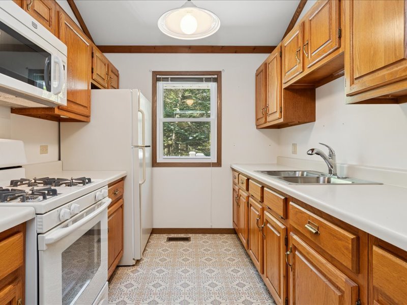 1323 Auburn Avenue Naperville, IL 60565 - Photo 7 of 16 a kitchen with stainless steel appliances granite countertop a stove and a sink
