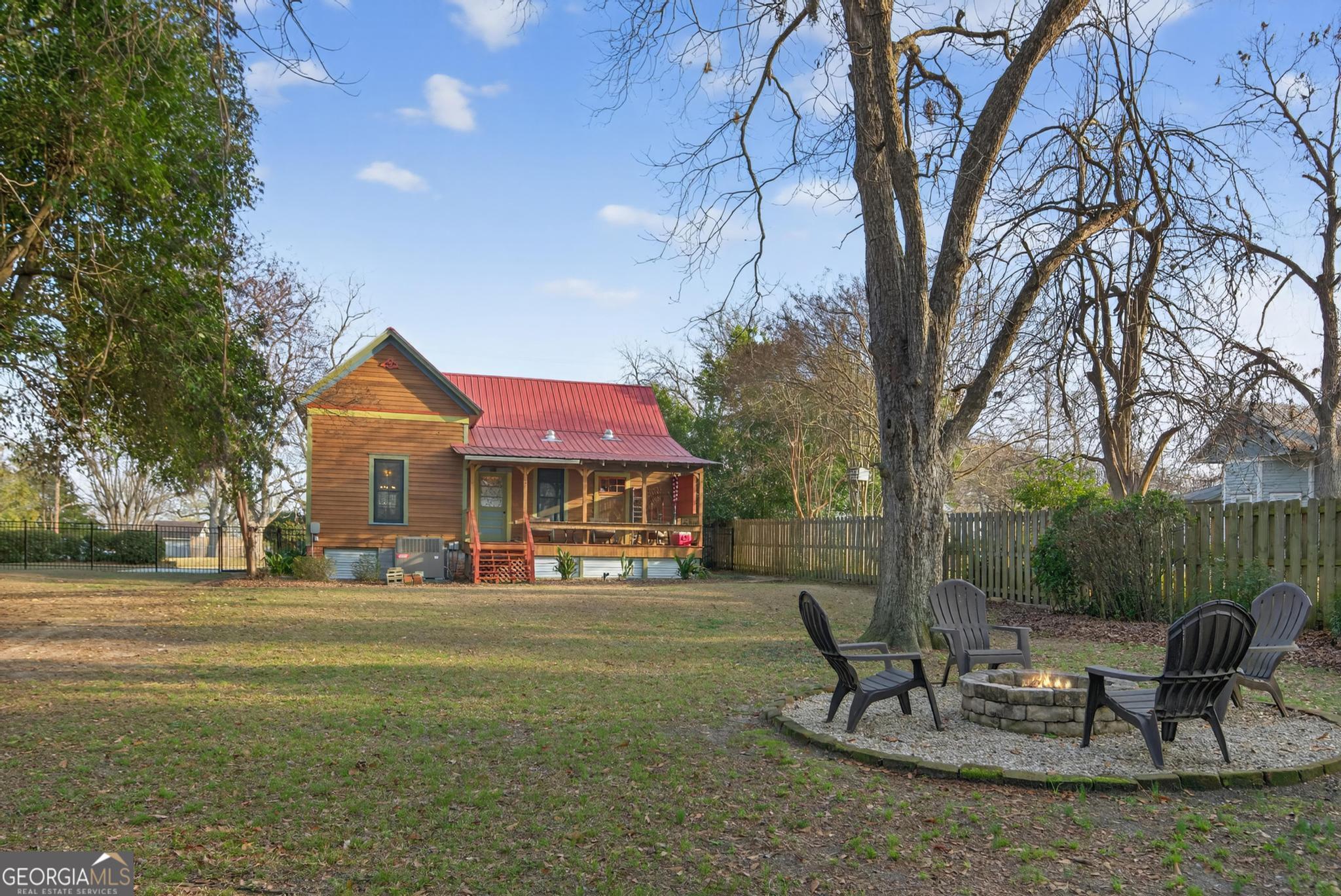 33 Main Street Register, GA 30452 - Photo 9 of 23 a view of a house with backyard and sitting area