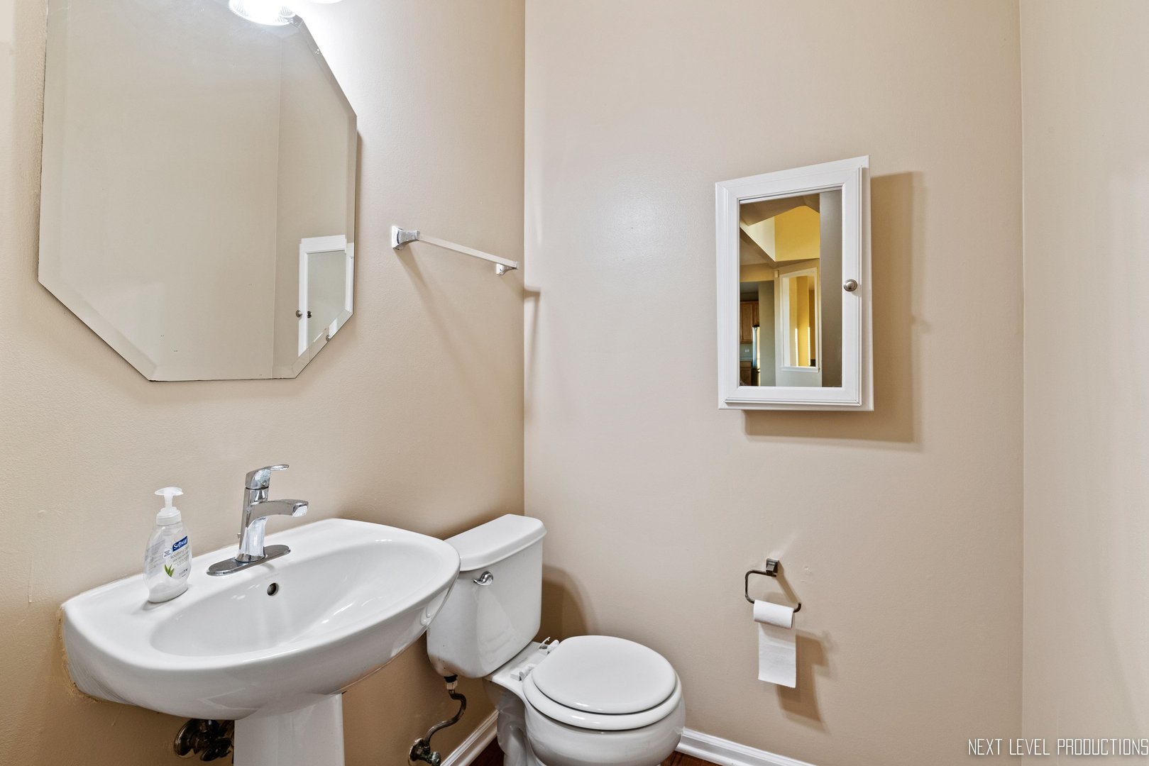 230 Tiger Street Bolingbrook, IL 60490 - Photo 15 of 27 a bathroom with a toilet sink and mirror