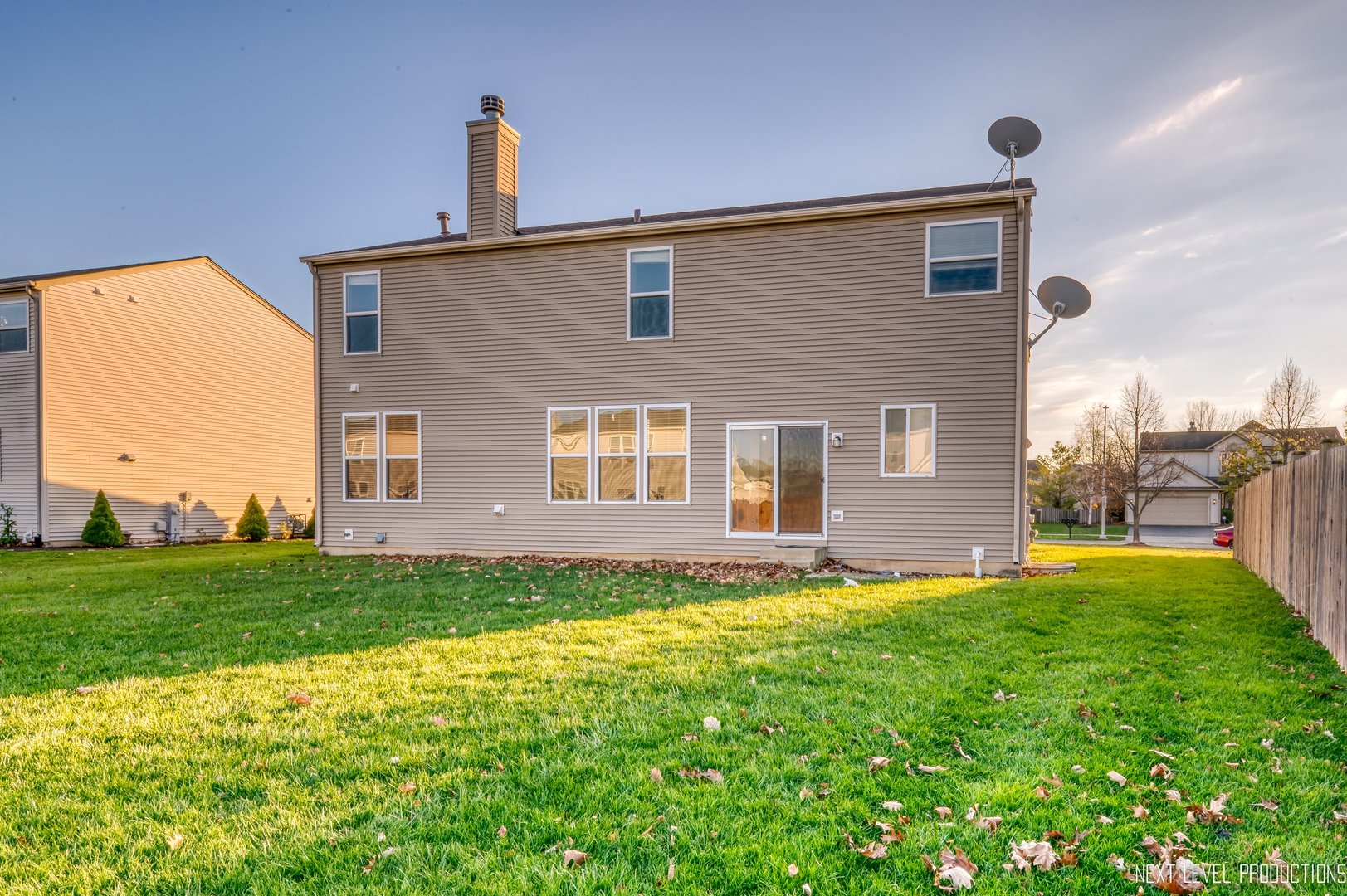 230 Tiger Street Bolingbrook, IL 60490 - Photo 25 of 27 a front view of a house with a yard