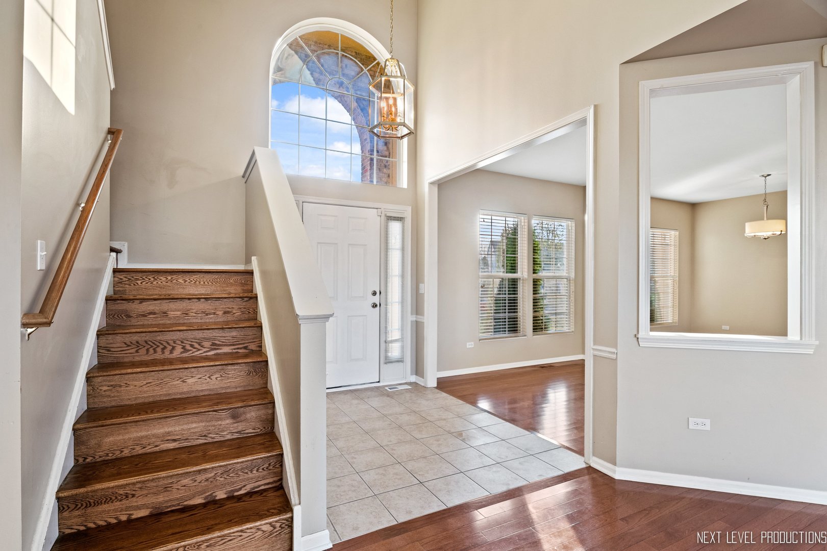 230 Tiger Street Bolingbrook, IL 60490 - Photo 4 of 27 wooden floor view of an entryway with wooden floor and a front door