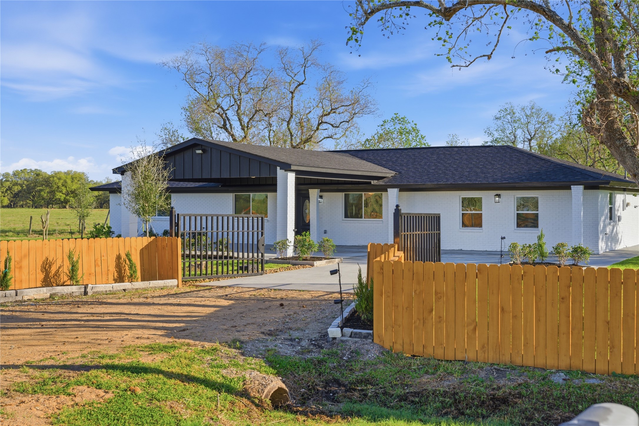 6623 County Road 4 Damon, TX 77430 - Photo 2 of 48 a view of a house with a yard