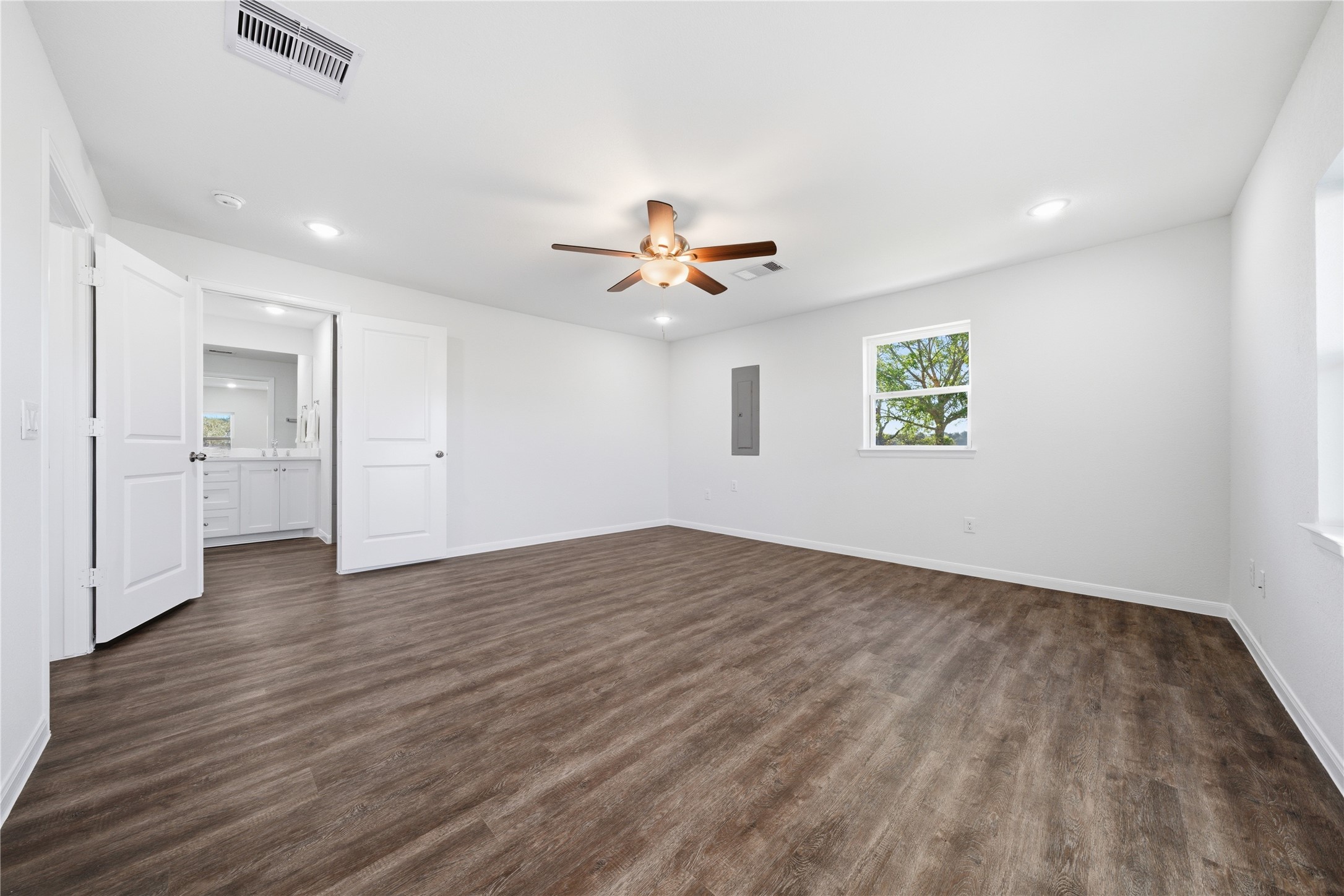 6623 County Road 4 Damon, TX 77430 - Photo 22 of 48 wooden floor in an empty room with a window