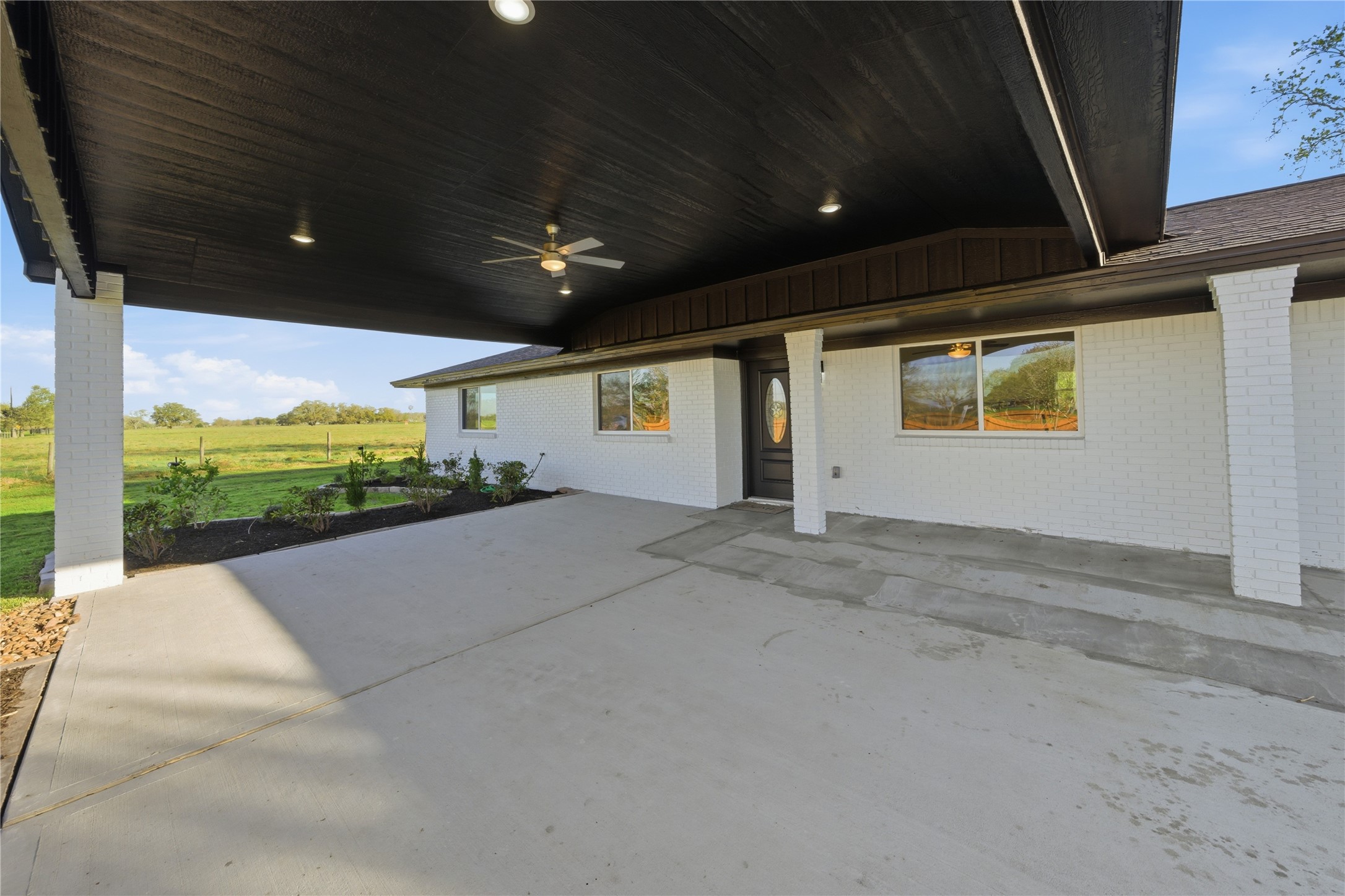 6623 County Road 4 Damon, TX 77430 - Photo 29 of 48 a view of a building stairs and a floor to ceiling window