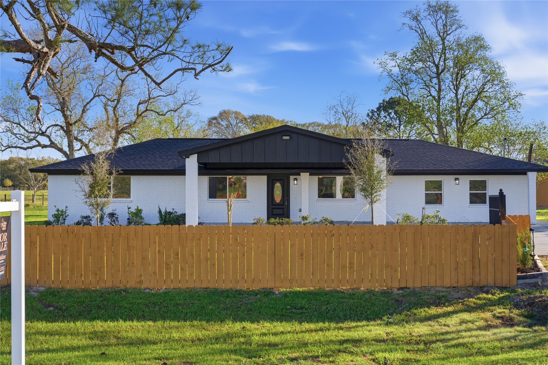 6623 County Road 4 Damon, TX 77430 - Photo 3 of 48 a front view of a house with a garden and yard