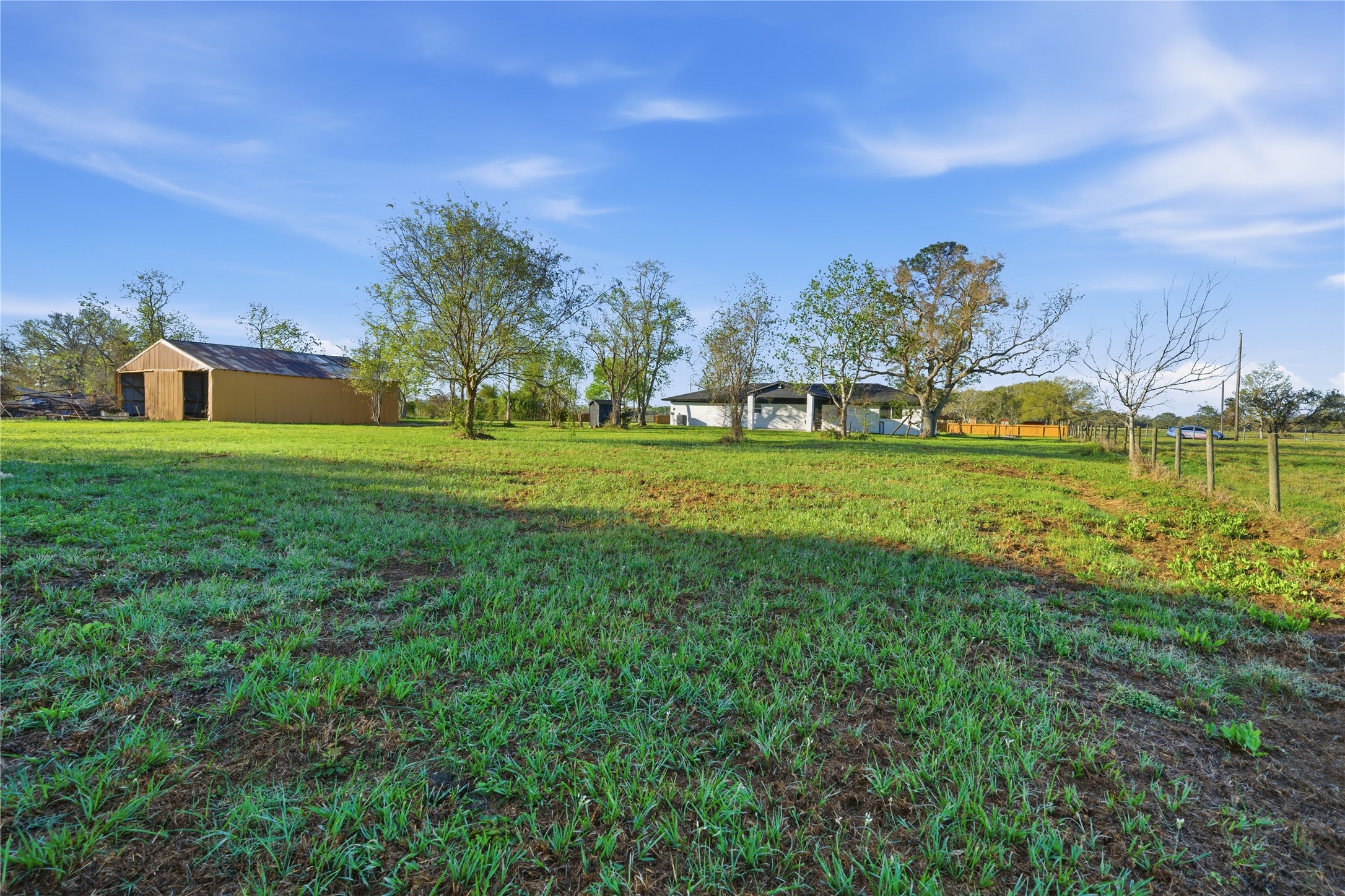 6623 County Road 4 Damon, TX 77430 - Photo 42 of 48 a view of a big yard with a house in the background