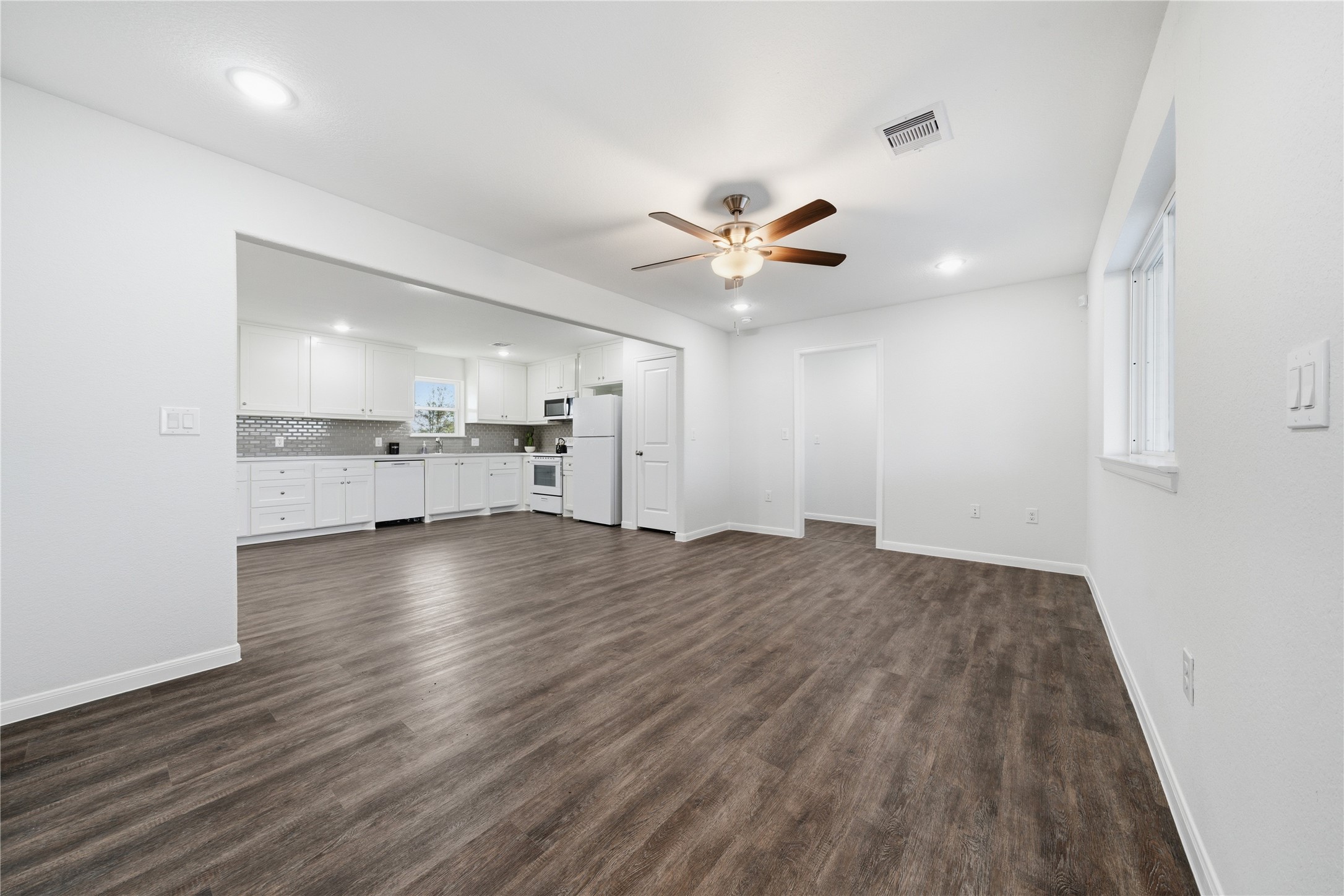 6623 County Road 4 Damon, TX 77430 - Photo 8 of 48 wooden floor in an empty room with a window