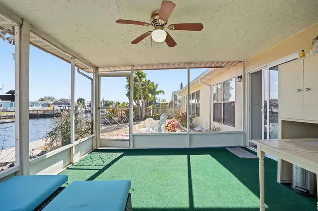 a view of a house with backyard and patio