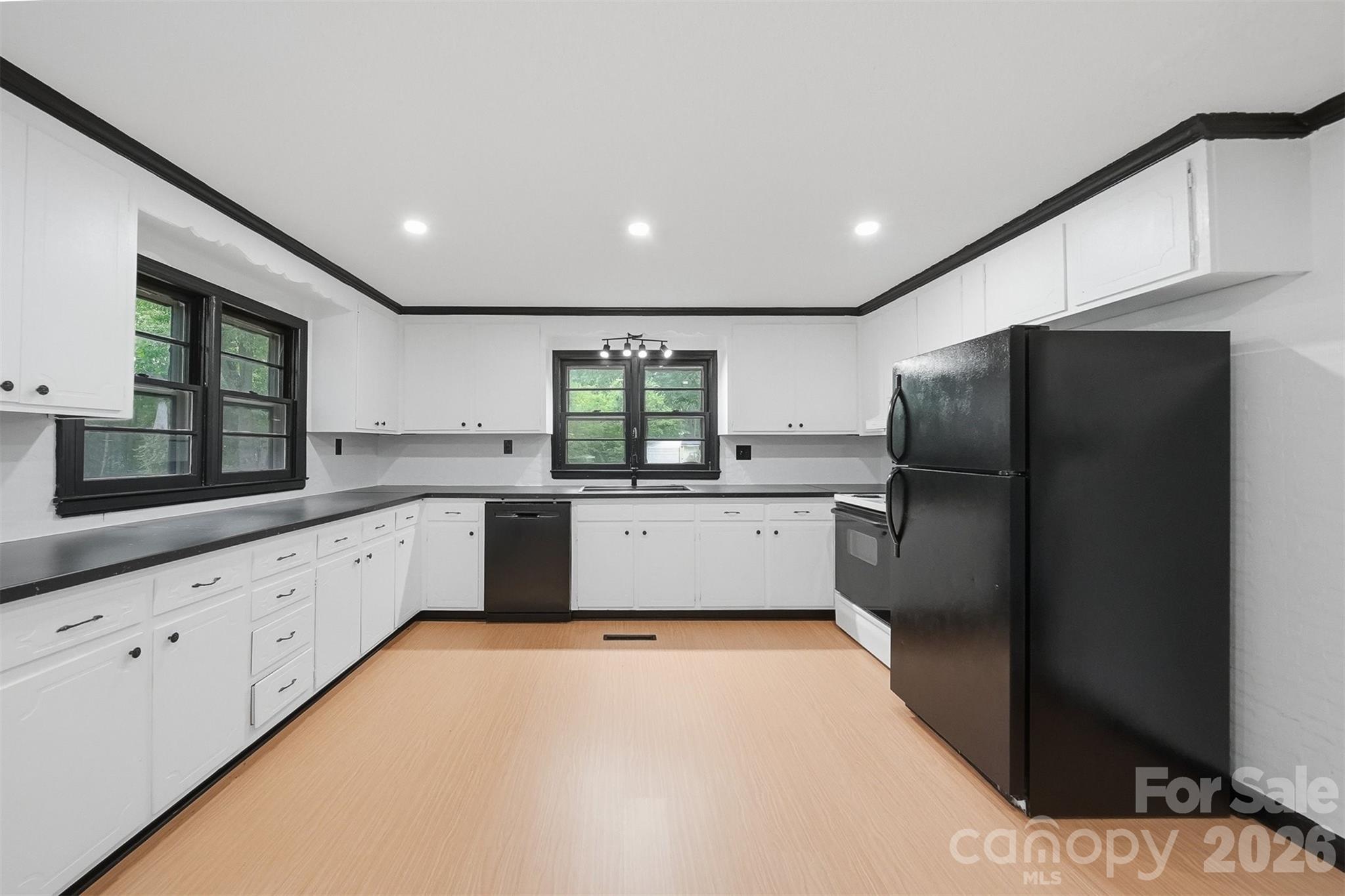 201 Cape Hickory Road Hickory, NC 28601 - Photo 5 of 16 a large kitchen with a large window and stainless steel appliances