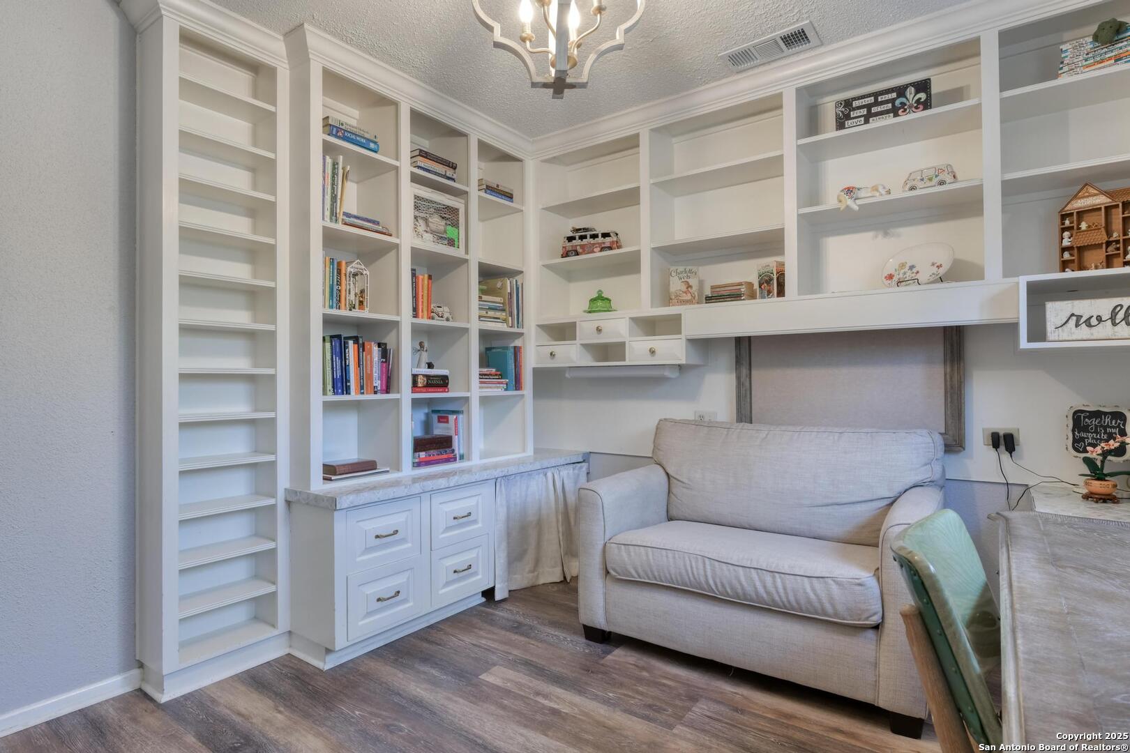 105 Shane Lane Boerne, TX 78006 - Photo 30 of 64 a living room with furniture and a book shelf