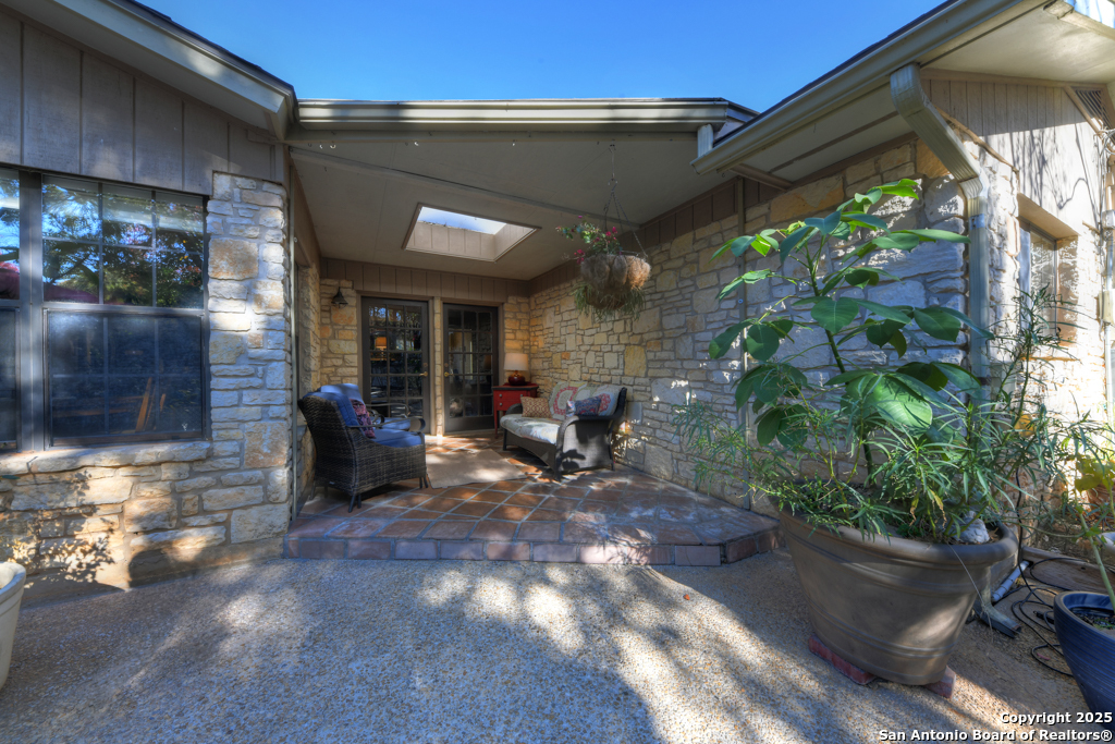 105 Shane Lane Boerne, TX 78006 - Photo 36 of 64 a view of a patio with table and chairs and potted plants