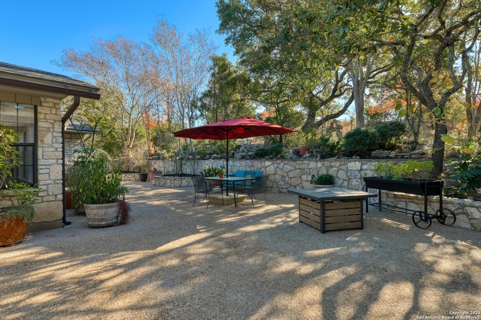 105 Shane Lane Boerne, TX 78006 - Photo 41 of 64 a backyard of a house with yard fire pit and outdoor seating