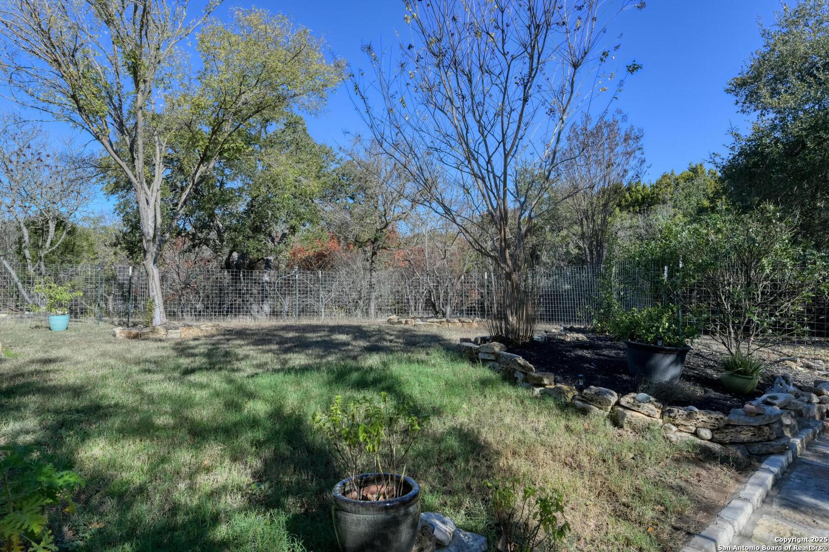 105 Shane Lane Boerne, TX 78006 - Photo 49 of 64 a backyard of a house with lots of green space