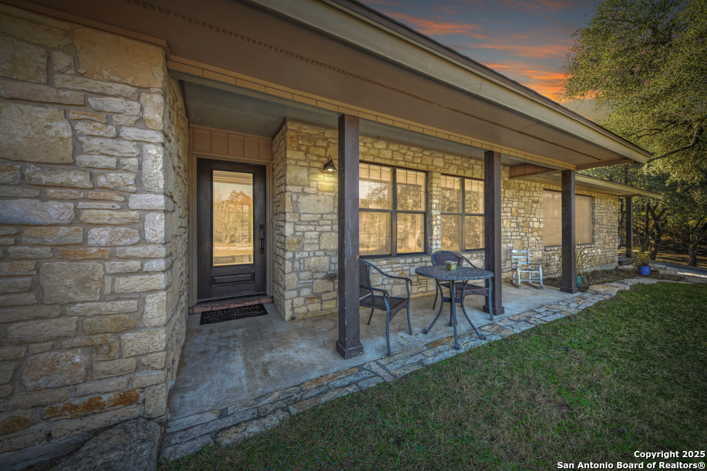 105 Shane Lane Boerne, TX 78006 - Photo 6 of 64 a view of a porch with chairs and backyard