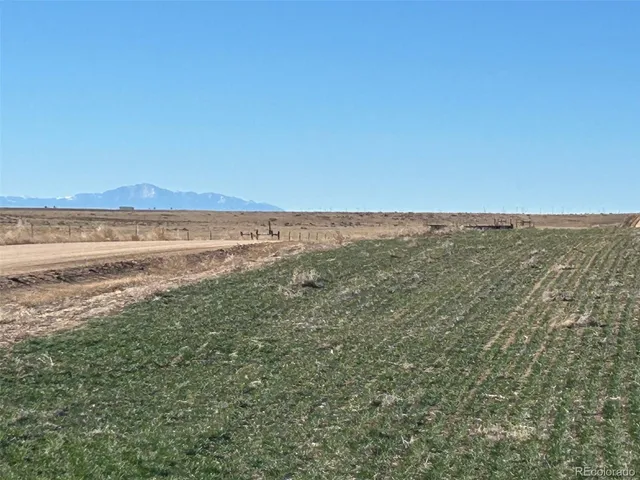 a view of an ocean beach and mountain