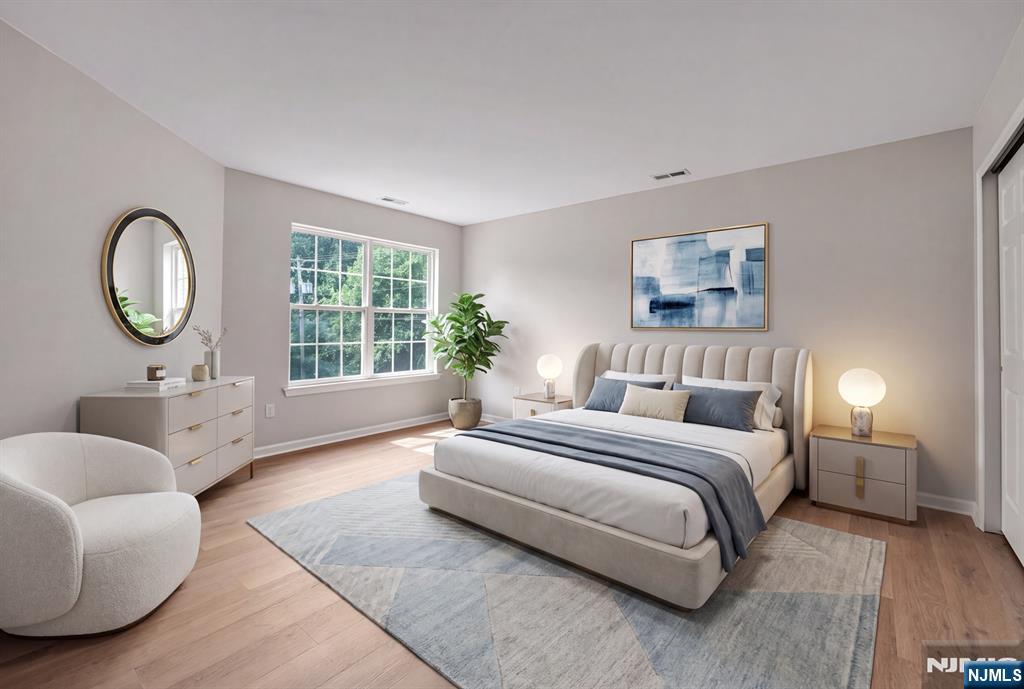1 Winding Ridge Road Lake Hopatcong, NJ 07849 - Photo 39 of 50 a spacious bedroom with a bed a couch and a large window
