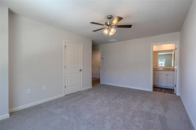 a view of an empty room and closet area