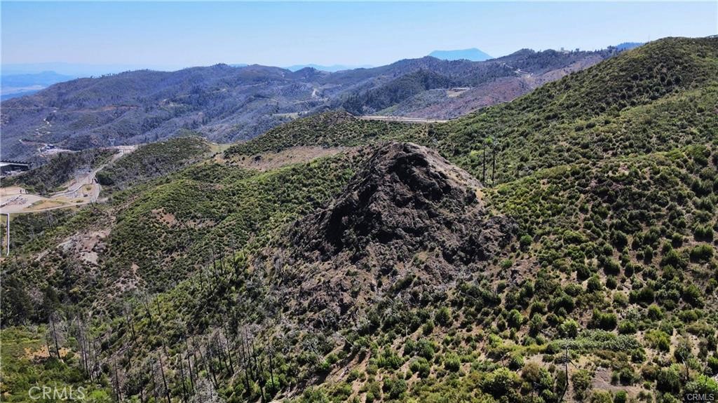 10155 Socrates Mine Road Middletown, CA 95461 - Photo 1 of 69 a view of a lush green hillside and a building