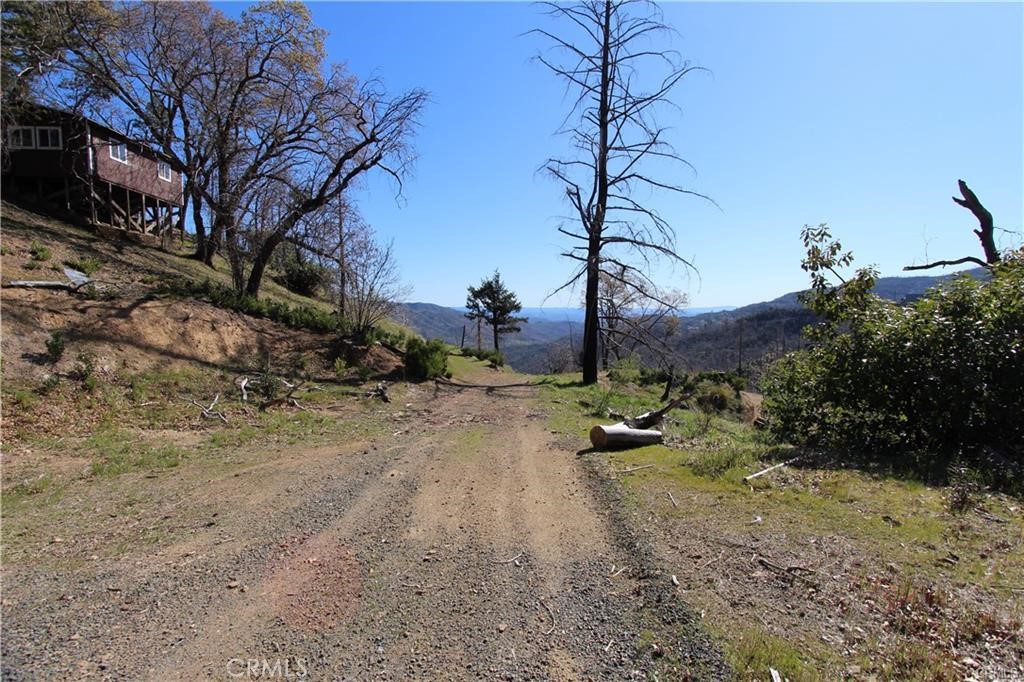 10155 Socrates Mine Road Middletown, CA 95461 - Photo 14 of 69 a backyard of a house with lots of green space