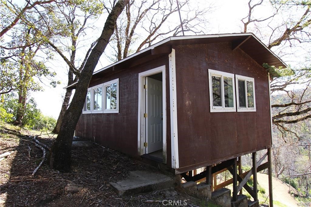 10155 Socrates Mine Road Middletown, CA 95461 - Photo 16 of 69 a house that has a tree in front of the house