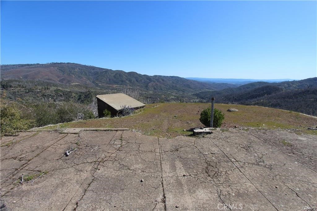 10155 Socrates Mine Road Middletown, CA 95461 - Photo 47 of 69 a view of a dry yard with mountain in the background