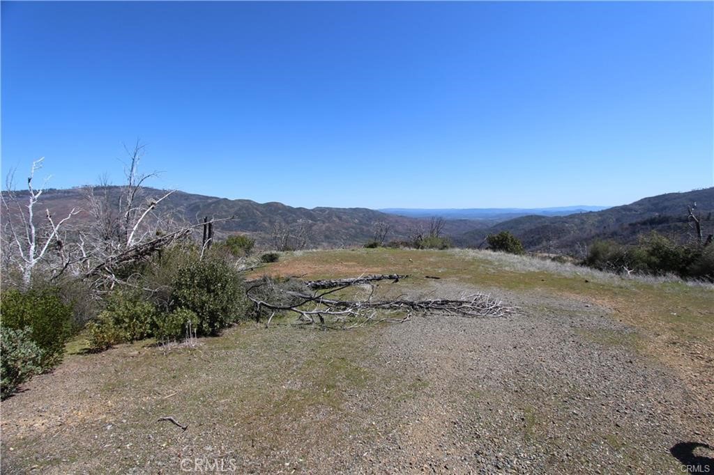 10155 Socrates Mine Road Middletown, CA 95461 - Photo 53 of 69 a view of a dry field with mountains in the background