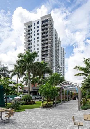 a front view of a building with garden