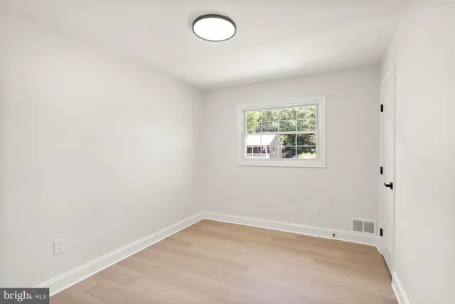 a bathroom with a shower and a mirror